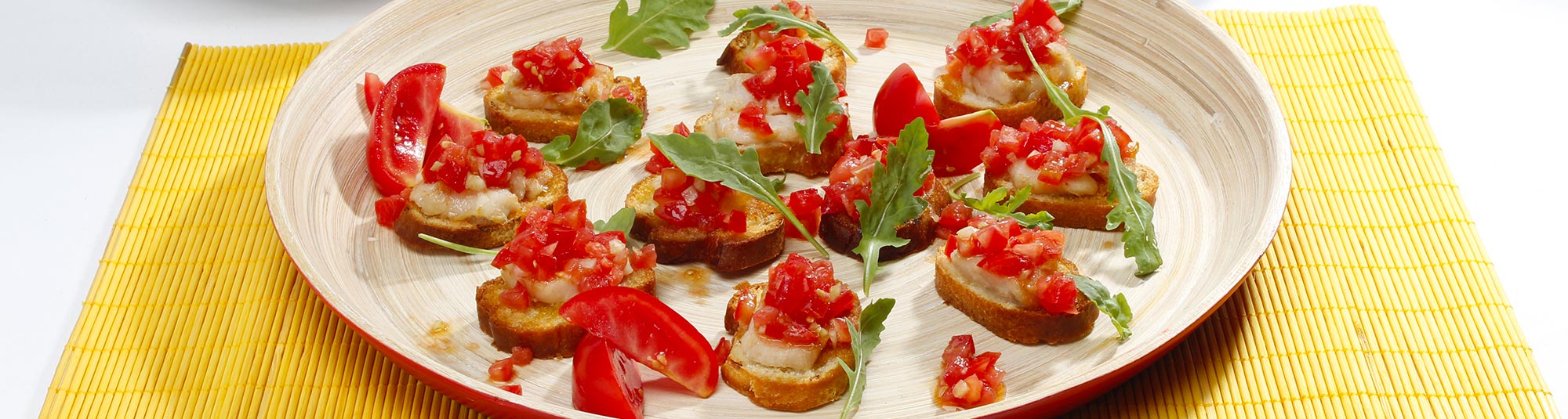Bruschettine di Fiori di Merluzzo con concassé di pomodoro - Ricette Findus