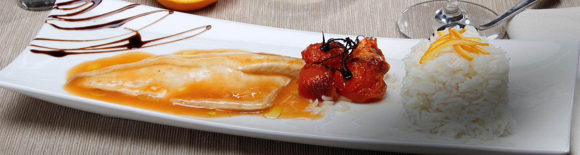 Ricetta filetto di branzino all'acqua pazza con riso pilaf all'arancia